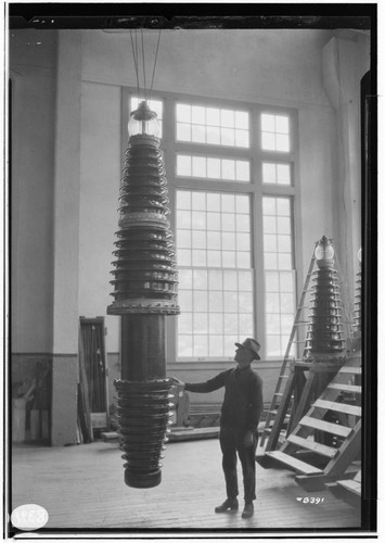 220kV Bushings from factory to service at Big Creek. Man standing by new bushing