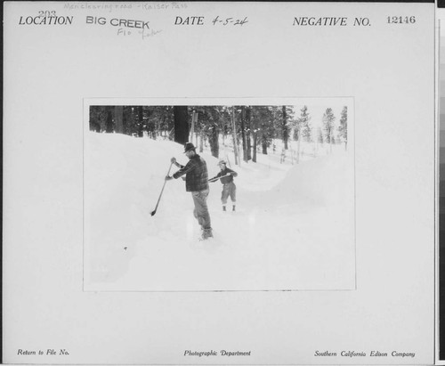 Big Creek, Florence Lake Dam - Men with shovels clearing snow from road over Kaiser Pass