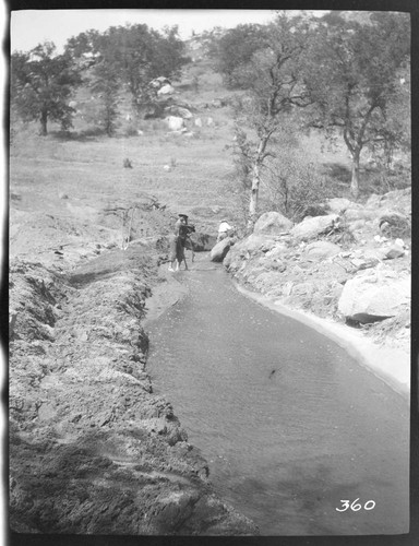 A construction crew working on the nearly completed ditch at Tule Plant