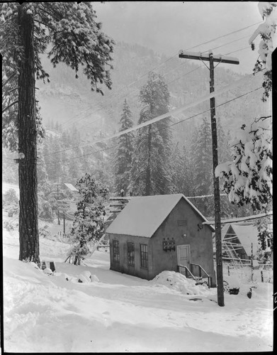 Exterior view of radio shack at Big Creek in snow