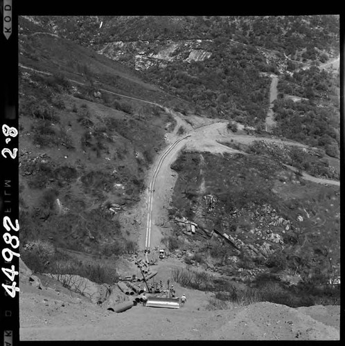 2-8 Tule Siphon - Progress photo. View from half way up outlet slope looking toward intake; distributing pipe along outlet slope