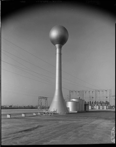 Natural Gas storage tank near substation racks