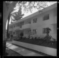 Men touring the opening of an apartment complex