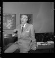 Man working and talking from his desk