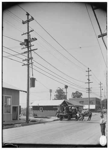 Raising transformer onto pole with electric truck