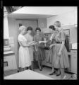 Ladies demonstrating Electric Kitchen equipment in a teaching kitchen