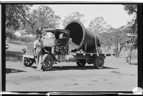 Trucks hauling penstock sections at Oak Flats