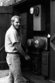 Customer service repairman checking a customers electric meter fuse buss