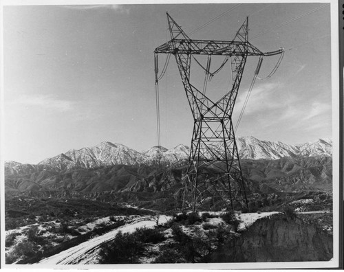 One tower of Edison's growing network of 500kV transmission lines stands sentinel in Cajon Pass in the winter of 1973