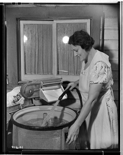 Mrs. _ and washing machine for fair exhibit