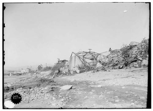 Distribution Lines - Result of the storm of 2/20/1914 - Tower demolished below Main Street Bridge. [background which is better seen in #02