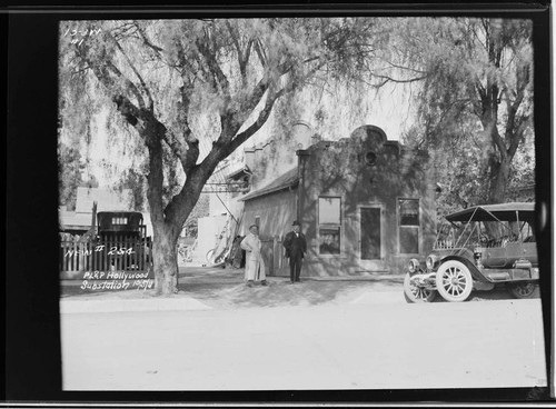 Two men standing by Pacific Light & Power's Hollywood Substation