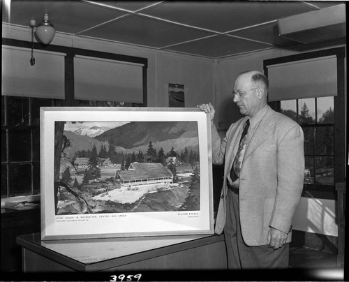 Man holding an archtectural rendering for a proposed Big Creek Clubhouse and Recreational Center