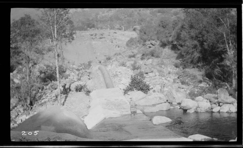 A siphon going through a small dam at Kaweah #3 Hydro Plant