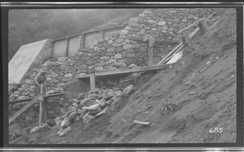 A man repairing a ditch at Kaweah #3 Hydro Plant