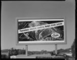 Small models of Edison "Flameless Electric Cooking Keeps Meat Juicier - Live Better Electrically" billboards