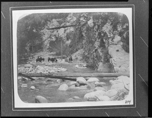 Men on horseback surveying the transmission lines along the Santa Ana River