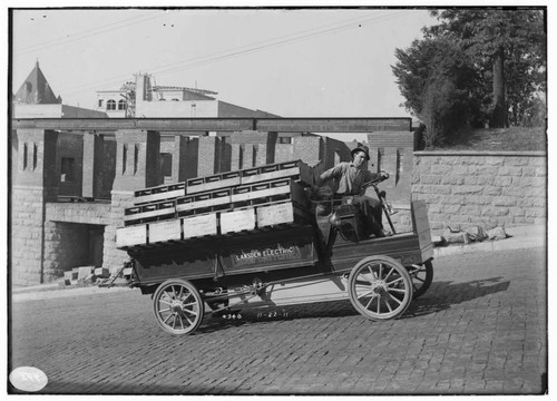 A man test driving the Lansden Electric truck on Grand Avenue in Los Angeles