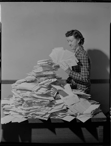 Envelope stack of "What I See Behind My Electric Bill" contest replies and Lillian Presnell