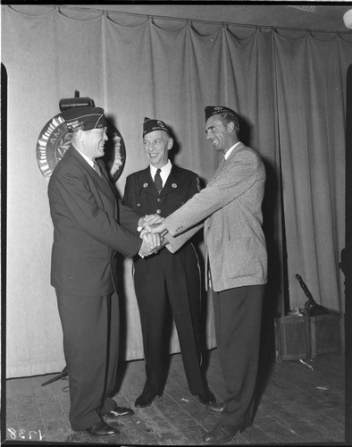 Three American Legion members shaking hands