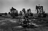 Oil field worker, drill rig set-up, and an energized electric substation