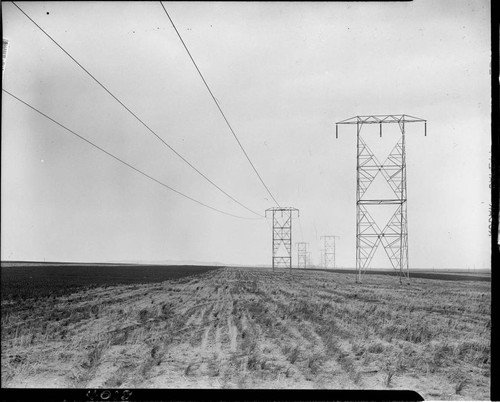 Pulling conductor through towers