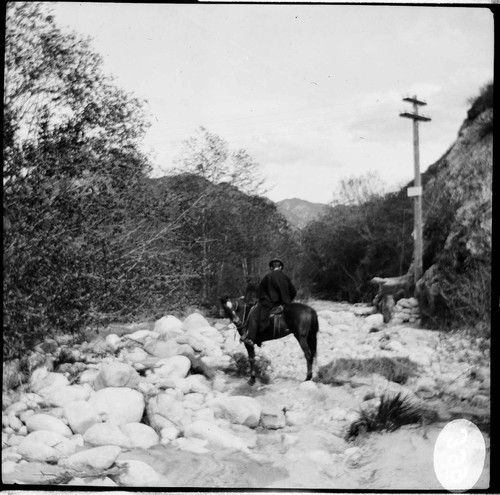 People riding horses in Santa Ana River Canyon along the transmission line during the floods