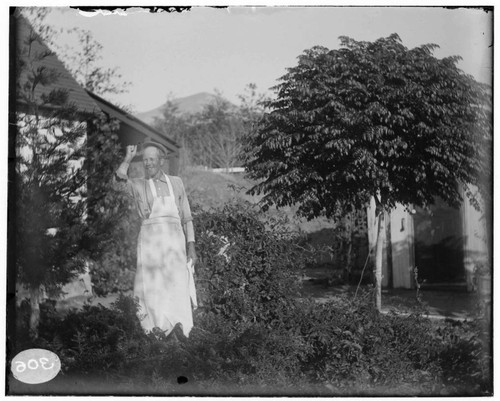 A man standing outside of an residence