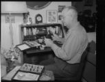 Photographer working with slide collection