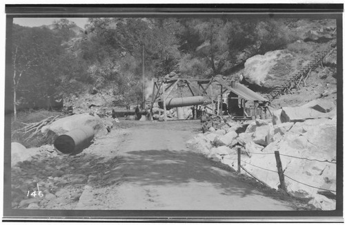 A construction crew works on hoisting the pressure pipe at Kaweah #3 Hydro Plant