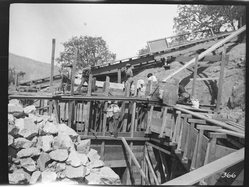 A crew standing at the completed flume of the Tule Plant