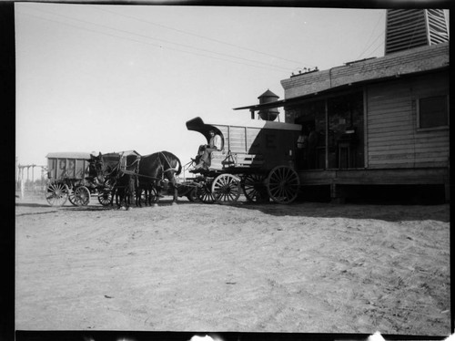 Ice Wagon pulled by team of horses at Imperial Ice Plant loading dock