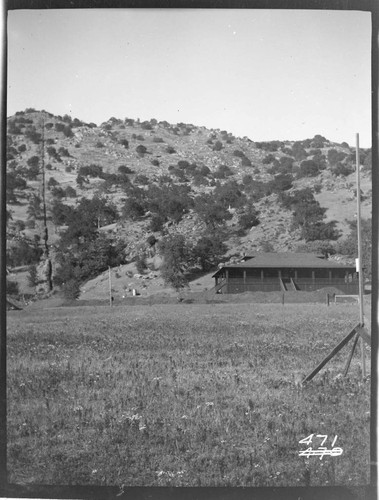 View of a cottage and the pipeline at Tule Plant