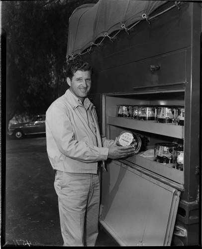 Customer service installer pulling new "one millionth" meter from truck