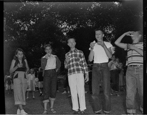 Kids eating at a picnic