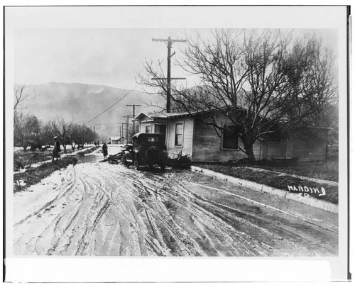 Aftermath of the St. Francis flood: a home washed partly across Harvard Blvd. in Santa Paula