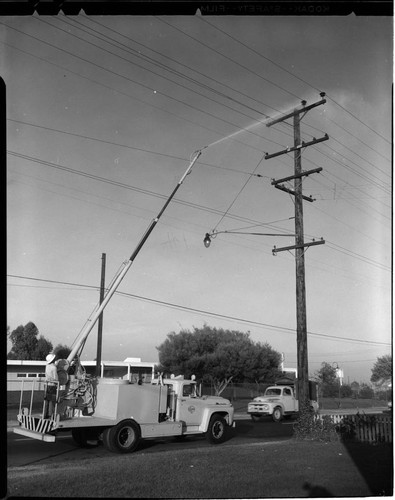 Line truck washing insulators