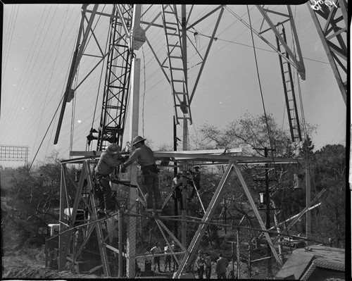 Construction work raising 12 circuit towers out of Eagle Rock Substation