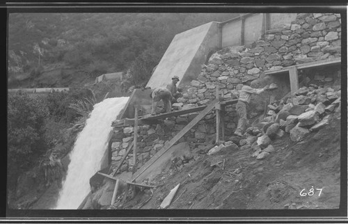 Several men making repairs to the ditch at Kaweah #3 Hydro Plant