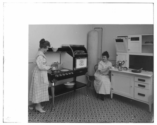 Hughes range and water heater in studio kitchen with Hoyt