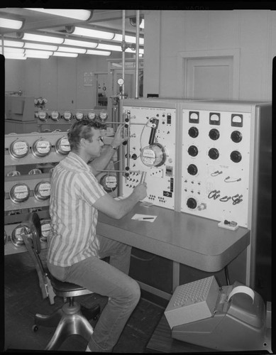 Technician testing electric meter