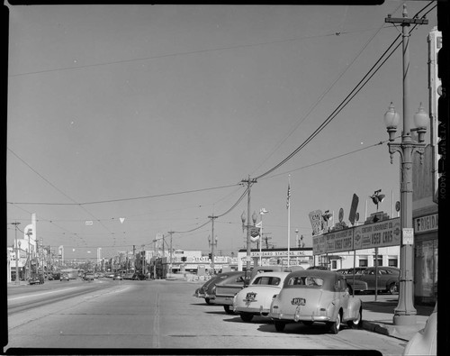 Century Chevrolet Used Cars, with electric trolley lines on street