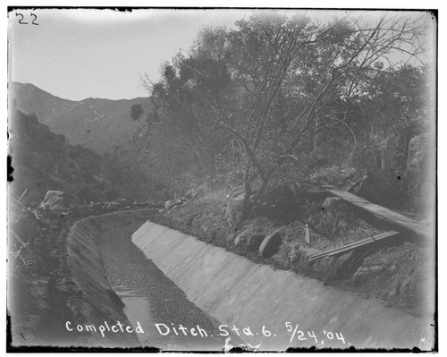 A completed ditch at Station 6 at Kaweah #2 Hydro Plant showing the mountains in the background