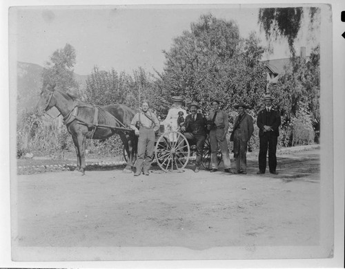 The operating staff of Mill Creek #1 Hydro Plant and the plant superintendent and his wife pose for an informal portrait with a buggy