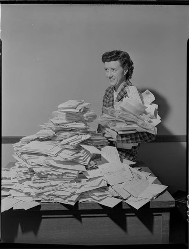 Envelope stack of "What I See Behind My Electric Bill" contest replies and Lillian Presnell