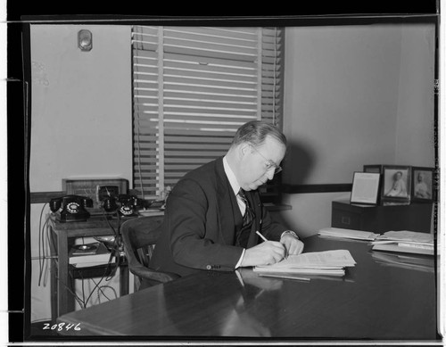 R.G. Kenyon at desk