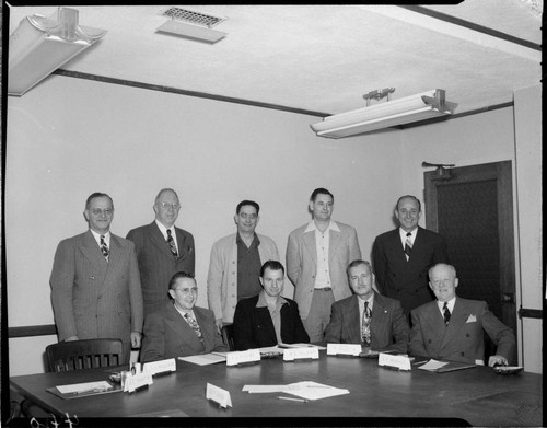 Posed photograph of 9 officers in Edison board room