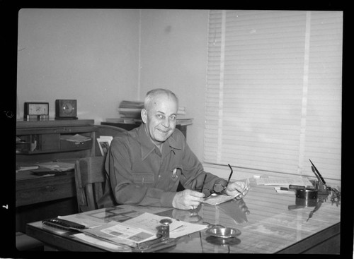 Office supervisor at his desk