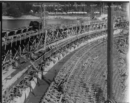 Photo shows the complex system of railroads and chuting employed to pour concrete the dams at Huntington Lake