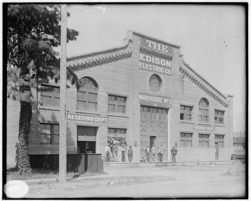 The operating crew standing in front of the Machine Shop & Warehouse No. 1 at Los Angeles #3 Steam Plant